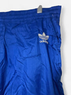Blue Adidas track pants with drawstring waist, zipper pockets and elasticated ankles adidas #trackpants