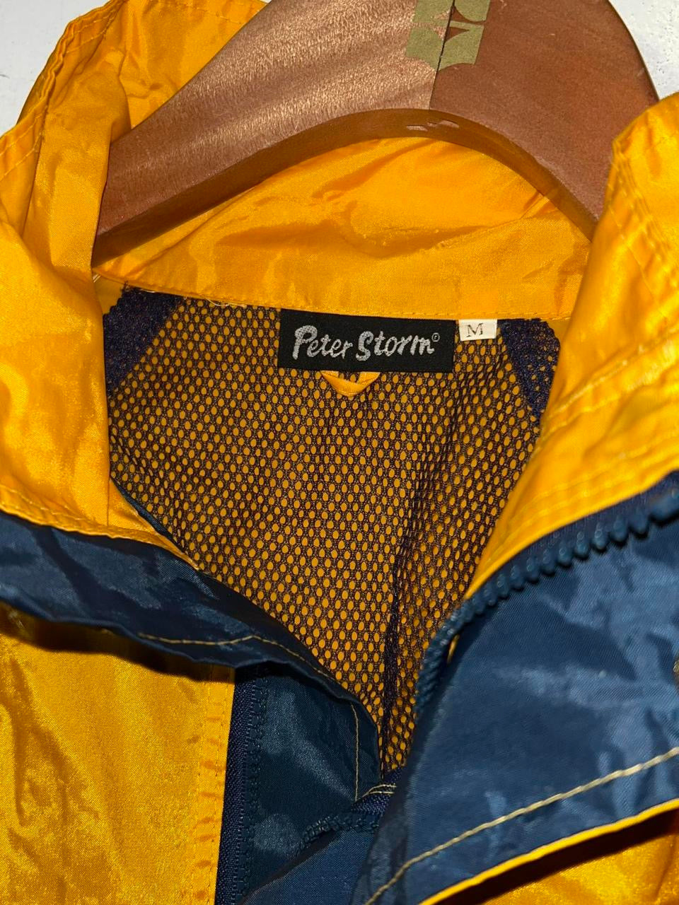 Peter Storm yellow and navy blue waterproof jacket in size M.