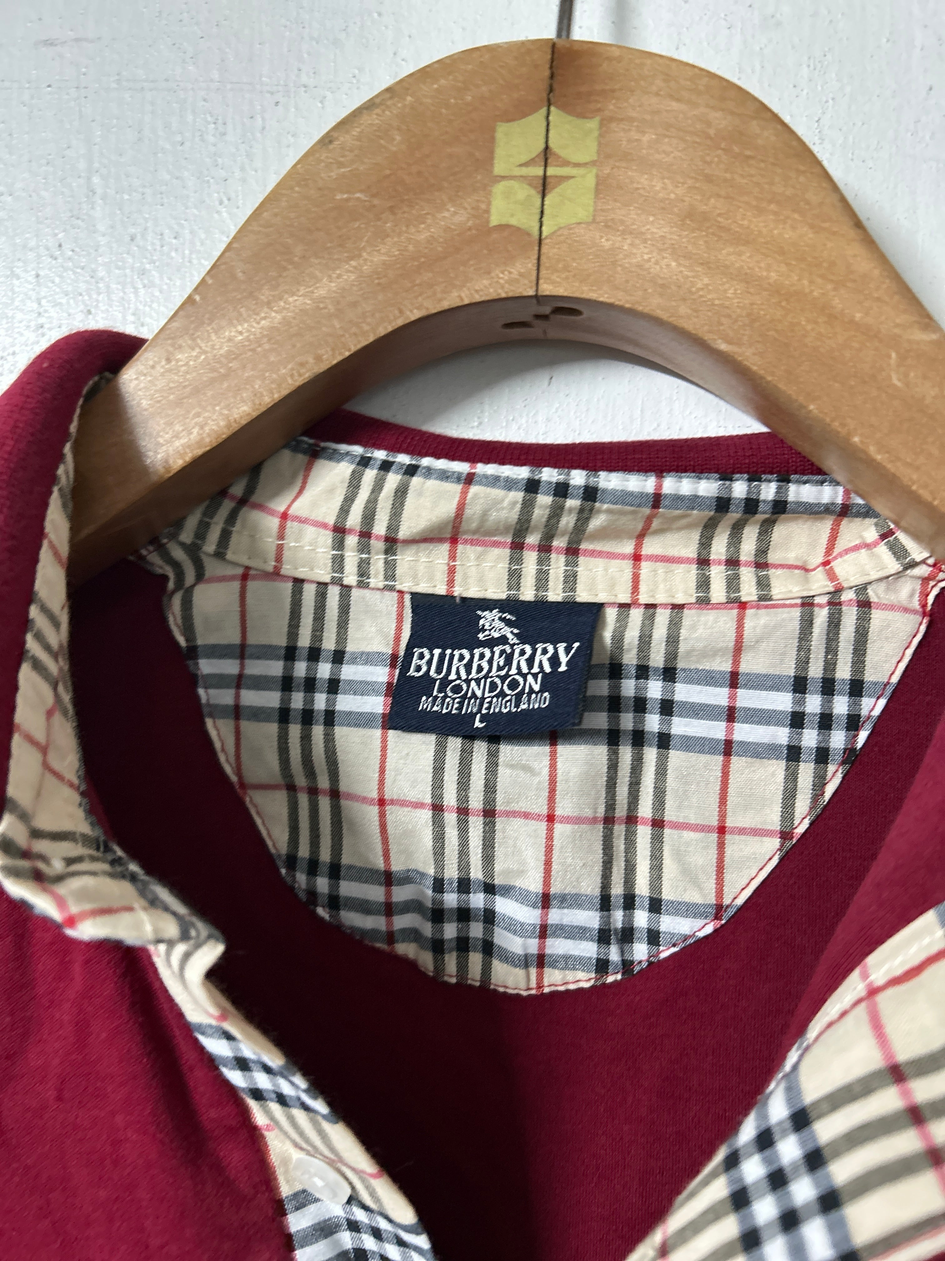 Women’s vintage Burberry London red cotton piqué polo shirt with Nova Check collar and logo embroidery.