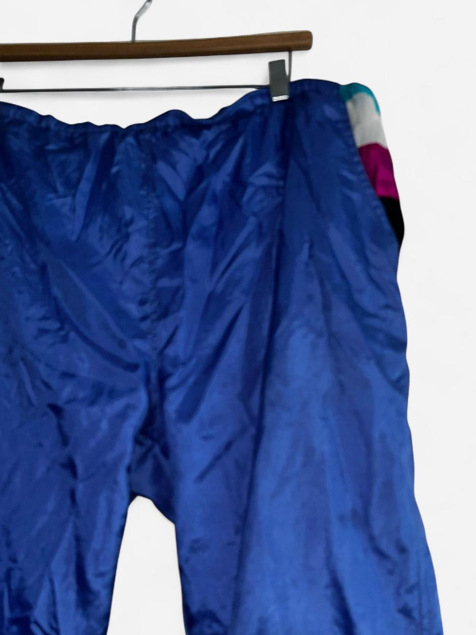 90s Blue vintage nylon sweatpants with elastic waistband, featuring a relaxed fit clothing in size medium Waist 36 length 30  sku 7056