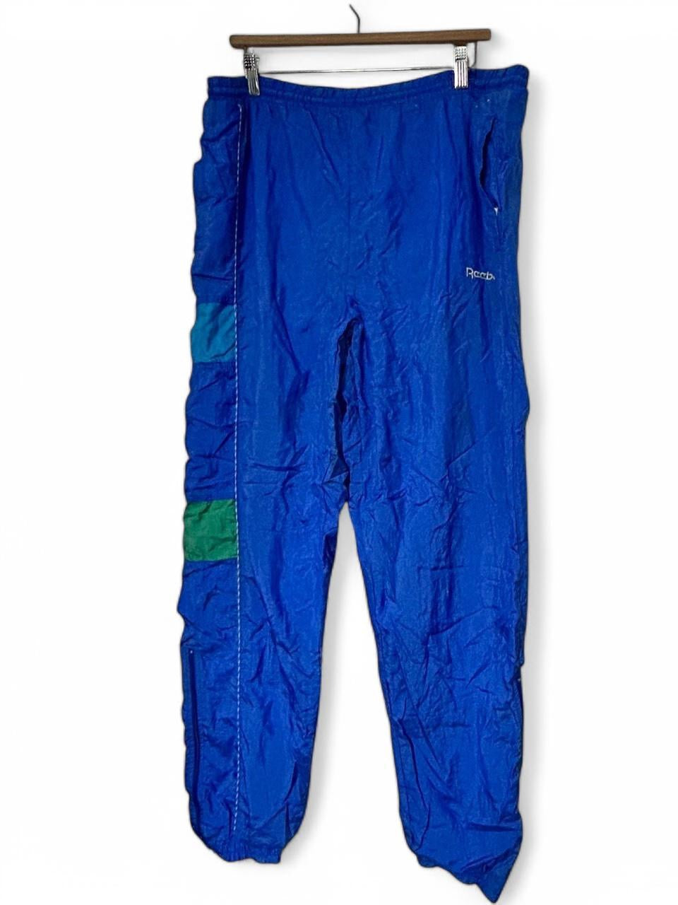 Blue Reebok track pants with elastic waistband and drawstring W30 L32 SKU 6960