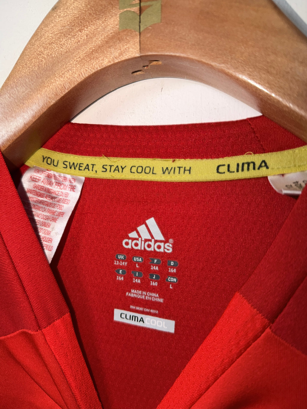 Adidas Men's Climacool short sleeve sport t-shirt in red with three-stripes style.  Kids 13-14 years old SKU 7352