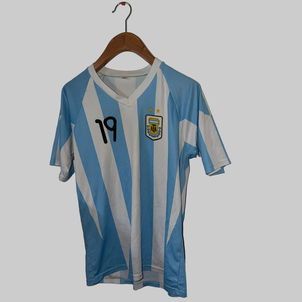 Blue and white striped sports jersey with number 19 on a hanger against a white wall.