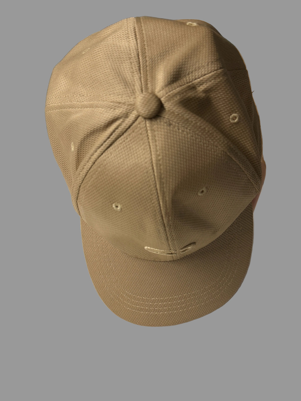 Brown cap on a white surface with a blurred background