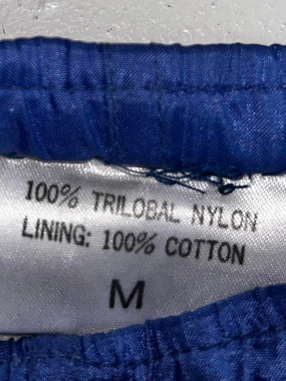 90s Blue vintage nylon sweatpants with elastic waistband, featuring a relaxed fit clothing in size medium Waist 36 length 30  sku 7056