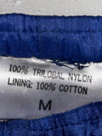 90s Blue vintage nylon sweatpants with elastic waistband, featuring a relaxed fit clothing in size medium Waist 36 length 30  sku 7056