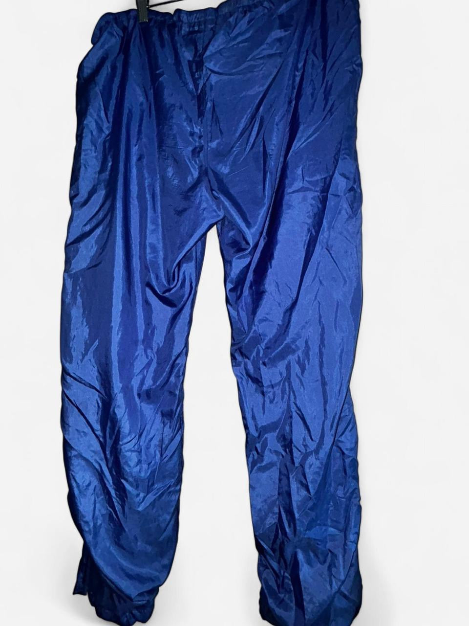 90s Blue vintage nylon sweatpants with elastic waistband, featuring a relaxed fit clothing in size medium Waist 36 length 30  sku 7056