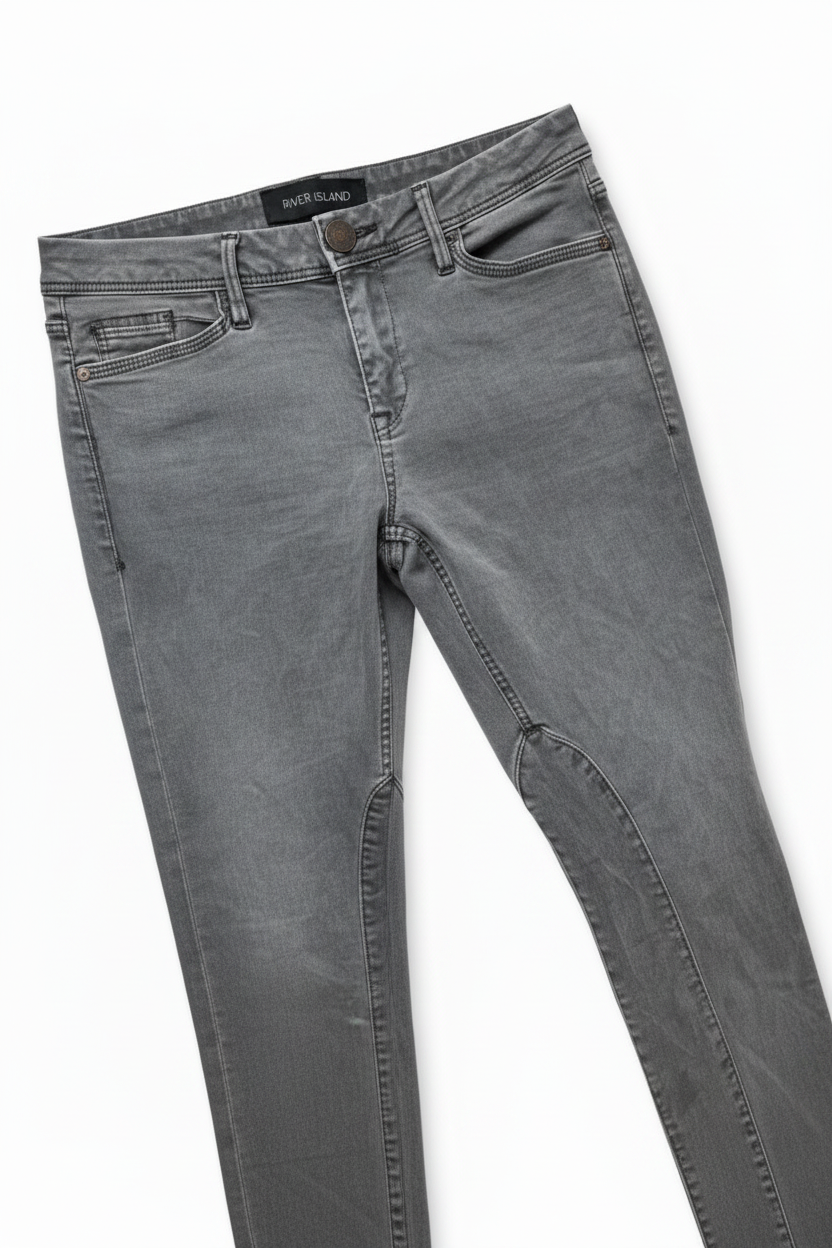 Gray washed denim jeans shown flat on a white background, angled diagonally.