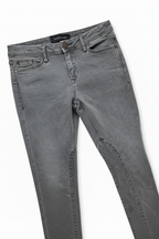 Gray washed denim jeans shown flat on a white background, angled diagonally.