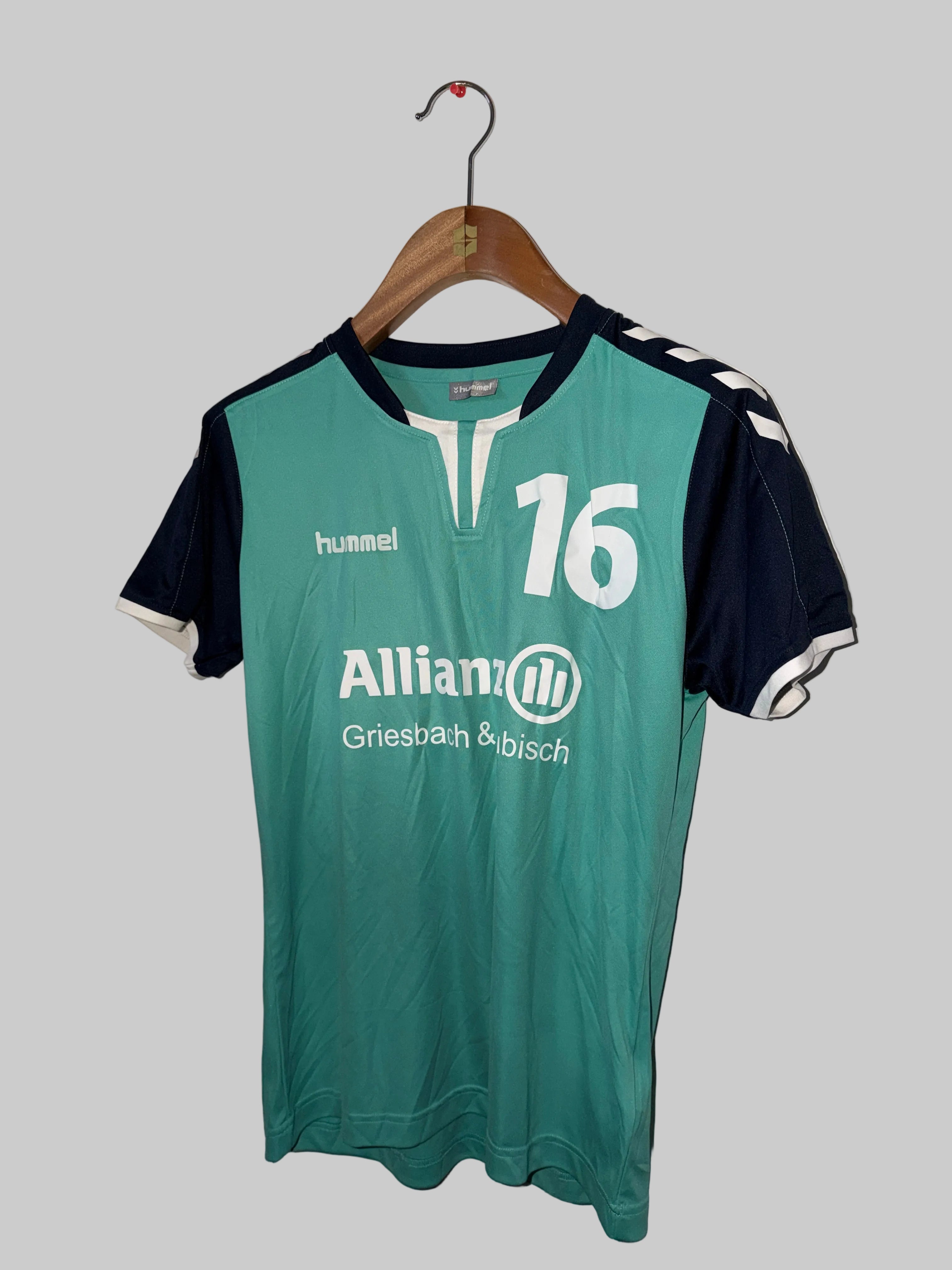 Hummel Core SS Poly Jersey, likely a team handball jersey for SC DHfK Leipzig, featuring the number 16 and sponsors "Allianz Griesbach & Bisch".  SizeSKU 7351