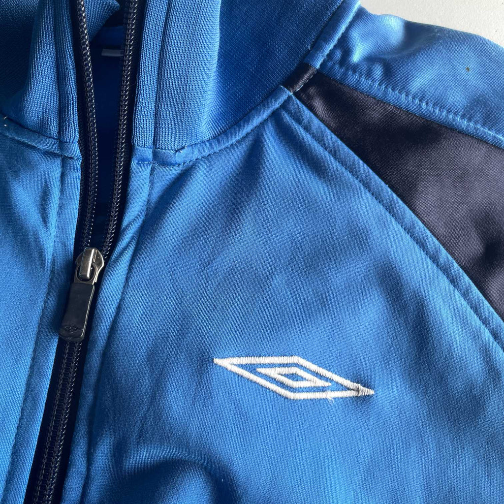 Vintage women Umbro blue full zip wind breaker track jacket in S|L27 W18| SKU 5630