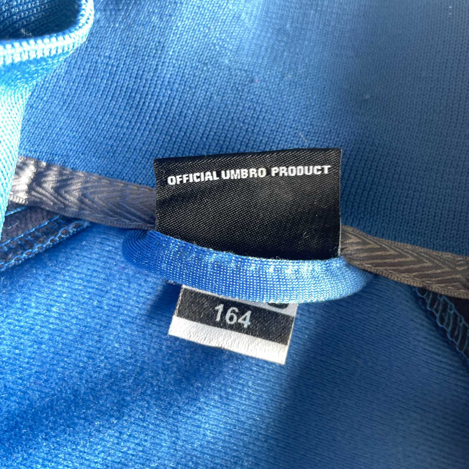 Vintage women Umbro blue full zip wind breaker track jacket in S|L27 W18| SKU 5630