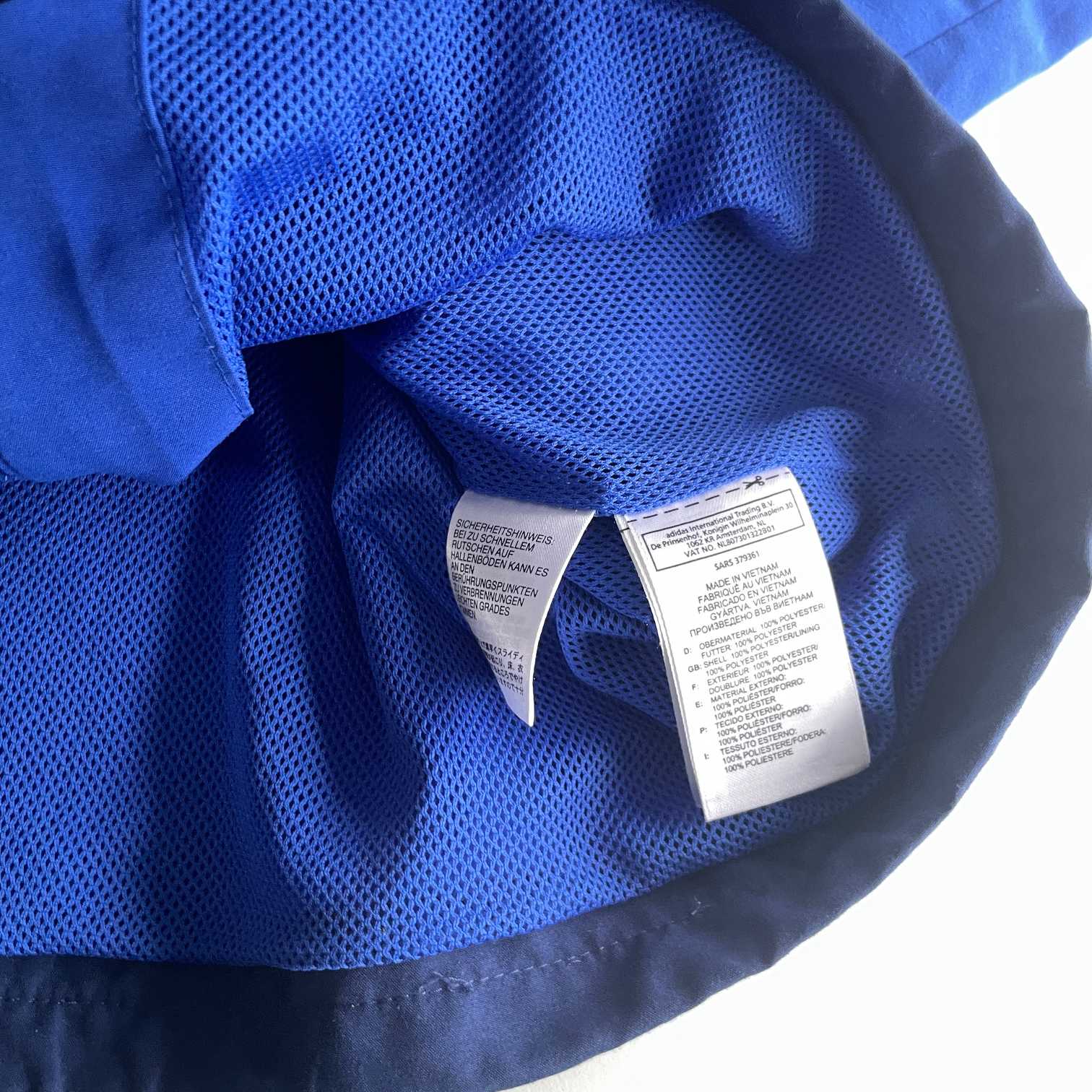 Vintage men Adidas blue full zip wind breaker track jacket in M/L|L30W21|SKU 5718