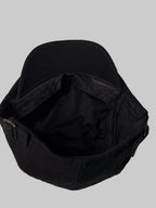 Black cap on a white surface