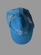 Blue cap with mesh back on a white surface
