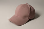 Brown cap on a white surface