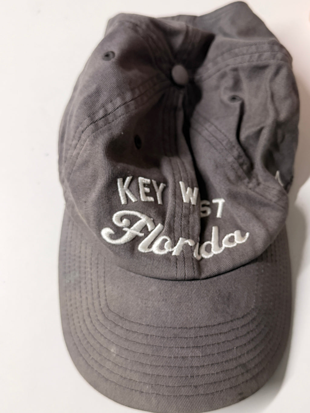 Gray cap with 'Key West Florida' text on a white background