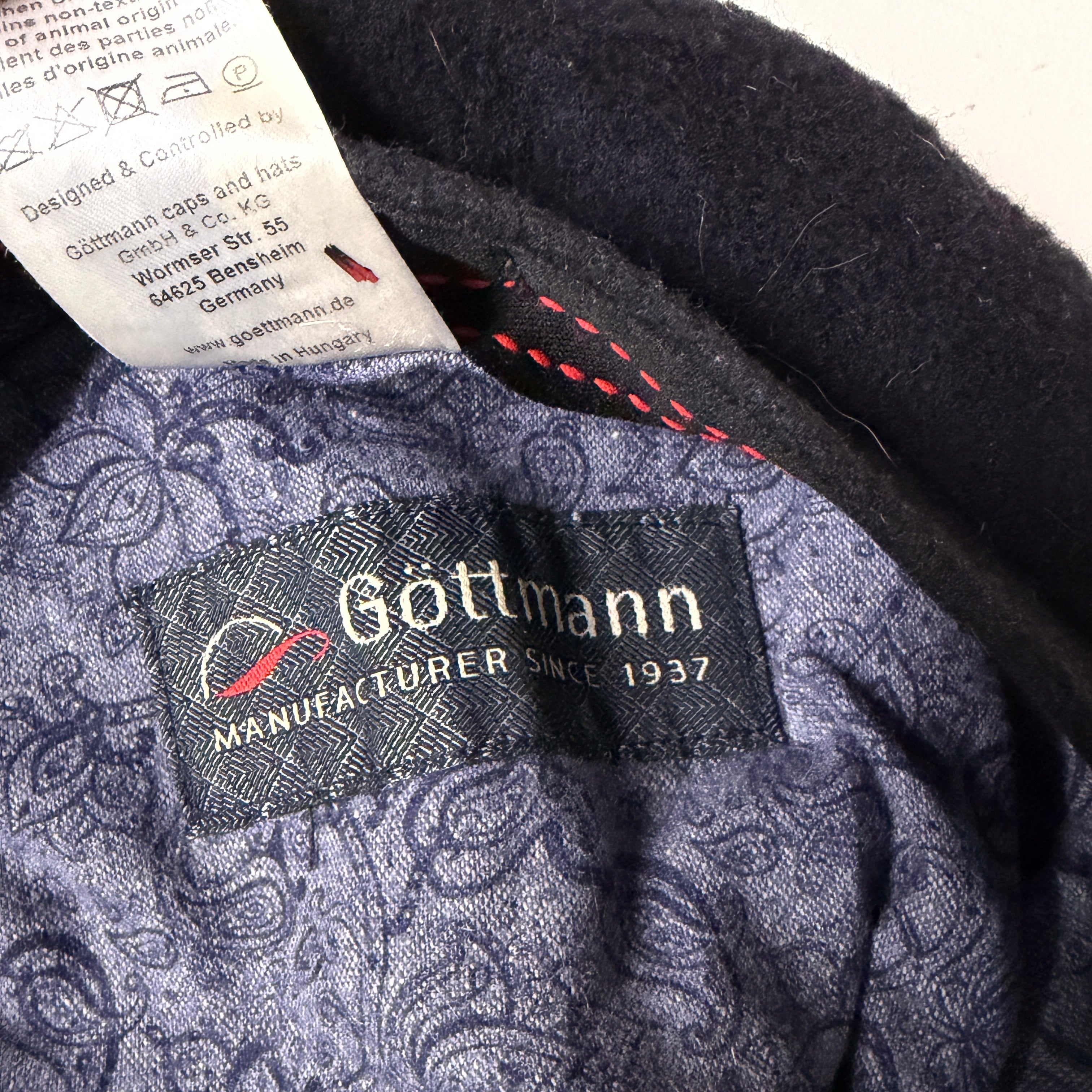 Close-up of a label on a piece of fabric with 'Gottmann' branding.