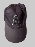 Black cap with a logo on a white background