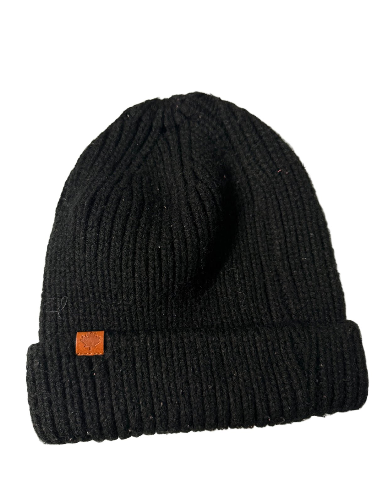 Black knit beanie with a brown logo tag on a white surface KU 7307