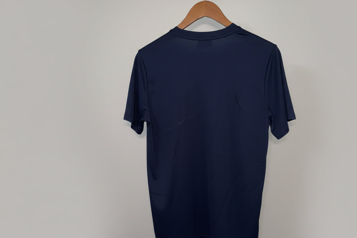 Nike Dri-FIT football jersey featuring a navy blue color with a white swoosh logo. SIZE L SKU 7466