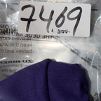 Metallic object with a label '7469' inside clear plastic packaging.