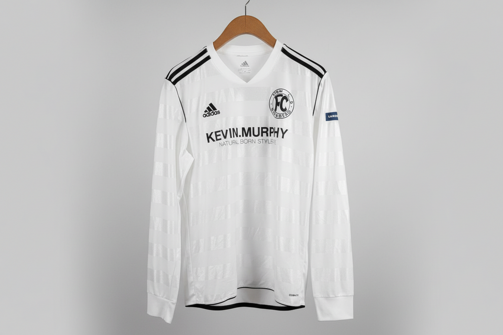 White sports jersey with black accents on a hanger against a gray background