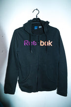 Vintage women Reebok print full zip black  hoodie in M|L29 W19|SKU 6673