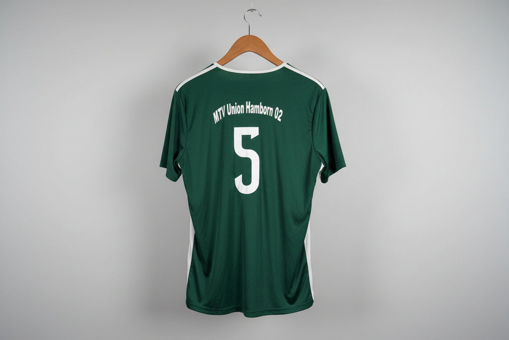 Green sports jersey with number 5 on a white floor