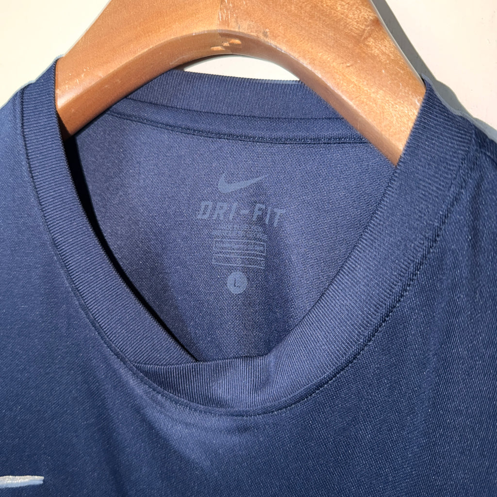 Nike Dri-FIT football jersey featuring a navy blue color with a white swoosh logo. SIZE L SKU 7466

