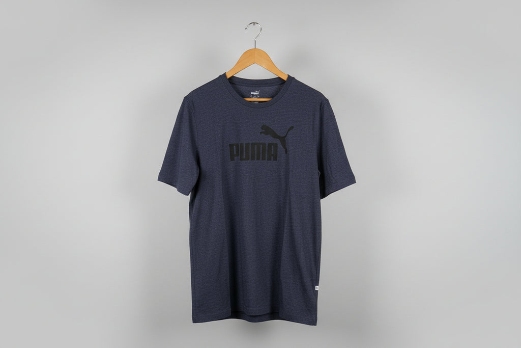 Navy blue sweatpants on a wooden hanger against a white background