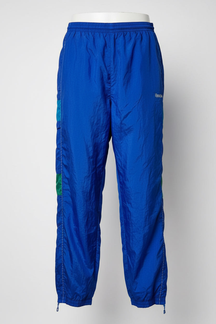Blue Reebok track pants with elastic waistband and drawstring W30 L32 SKU 6960