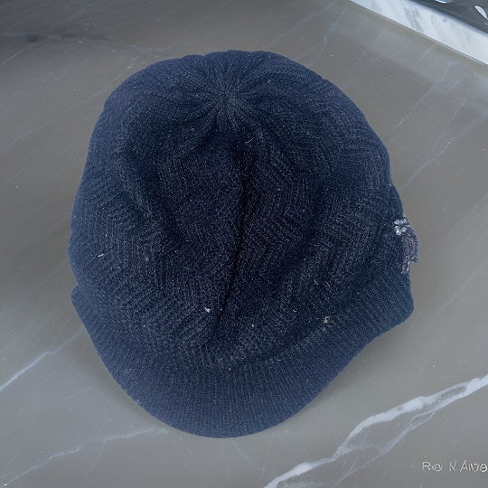 Vintage black lined knitted beanie hat with studded crest