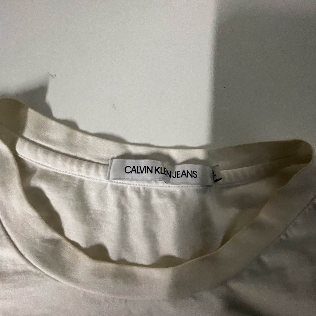 Vintage Women's Calvin Klein jeans graphics large white tees