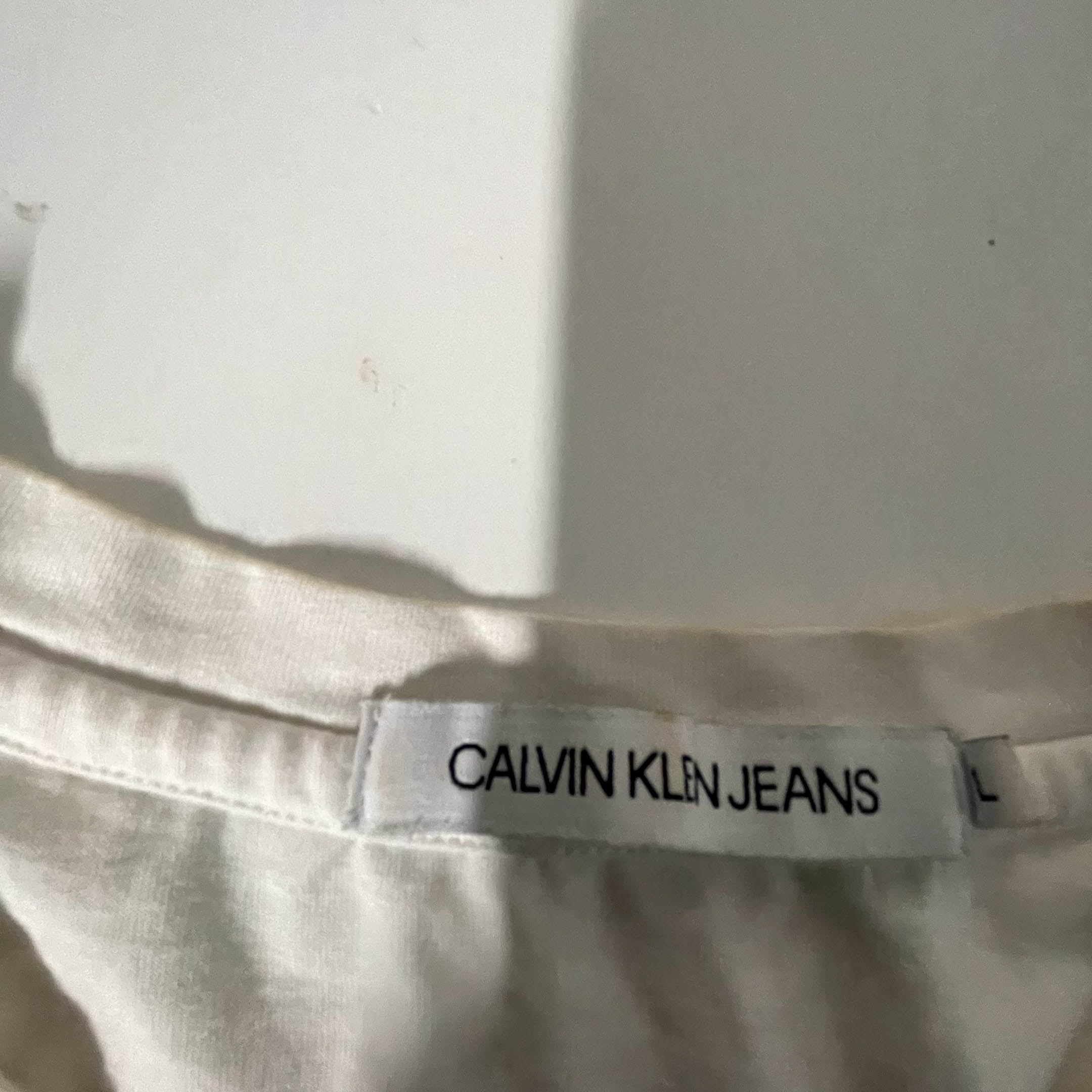 Vintage Women's Calvin Klein jeans graphics large white tees