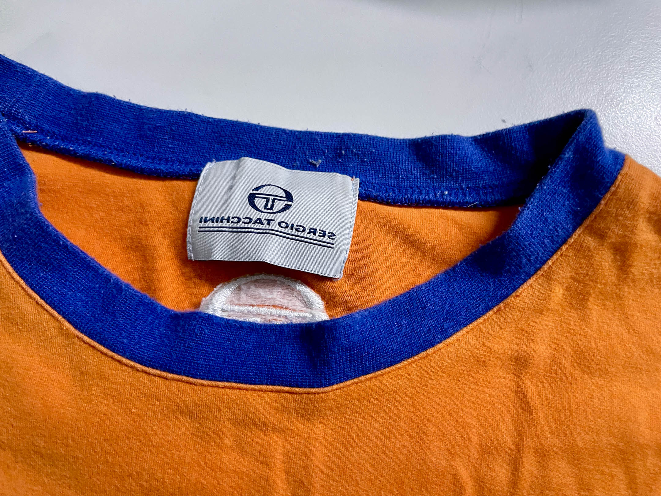 Vintage Men's Sergio Tacchini colorblock orange & white tees in L|L27 W18|SKU 4116
