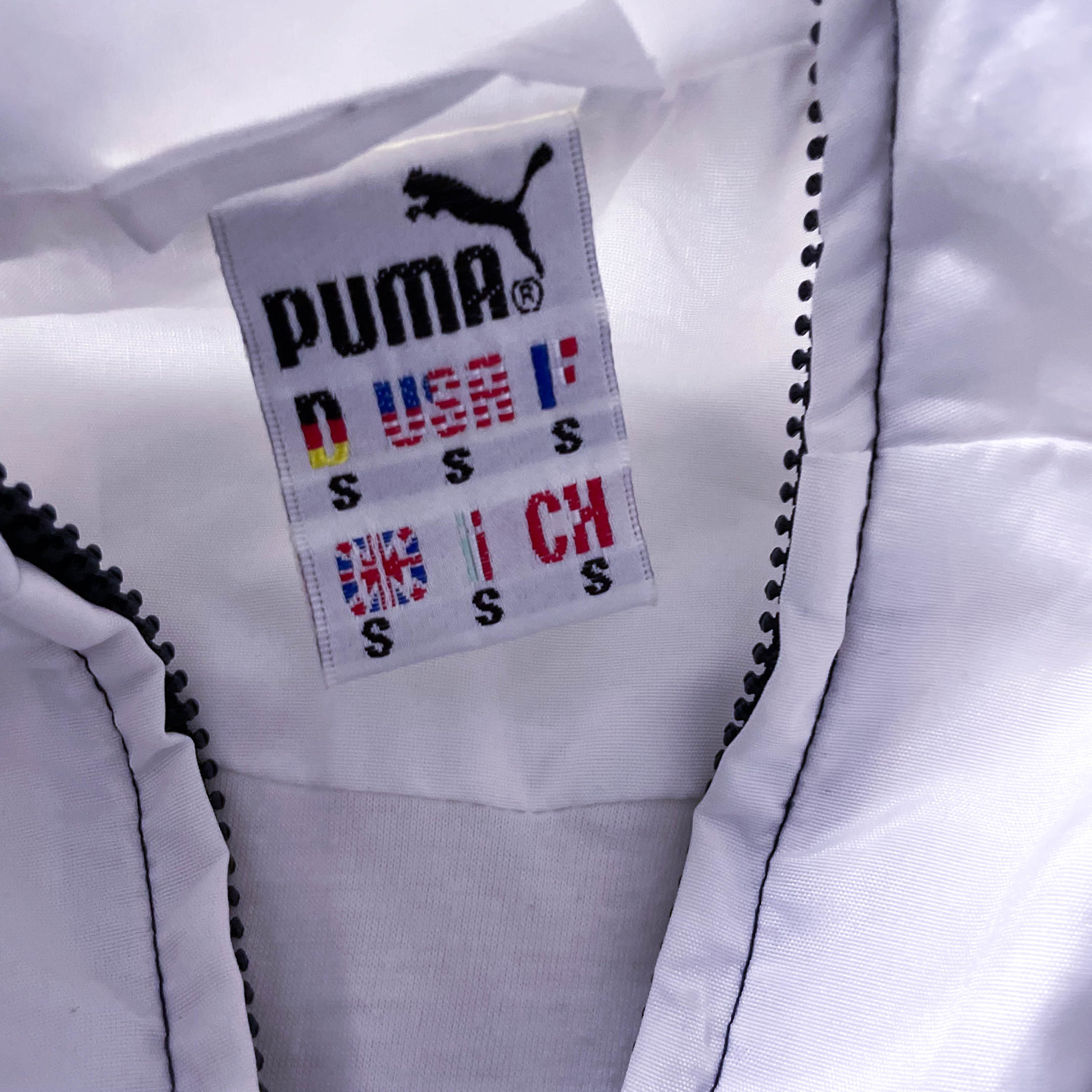 Vintage Men's Puma Castrol black multi stripe full zip jacket in S|L31 W22|SKU 3882