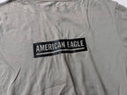 Vintage Men's American Eagle Cream standard fit tees in M|L27 W19|SKU 4132
