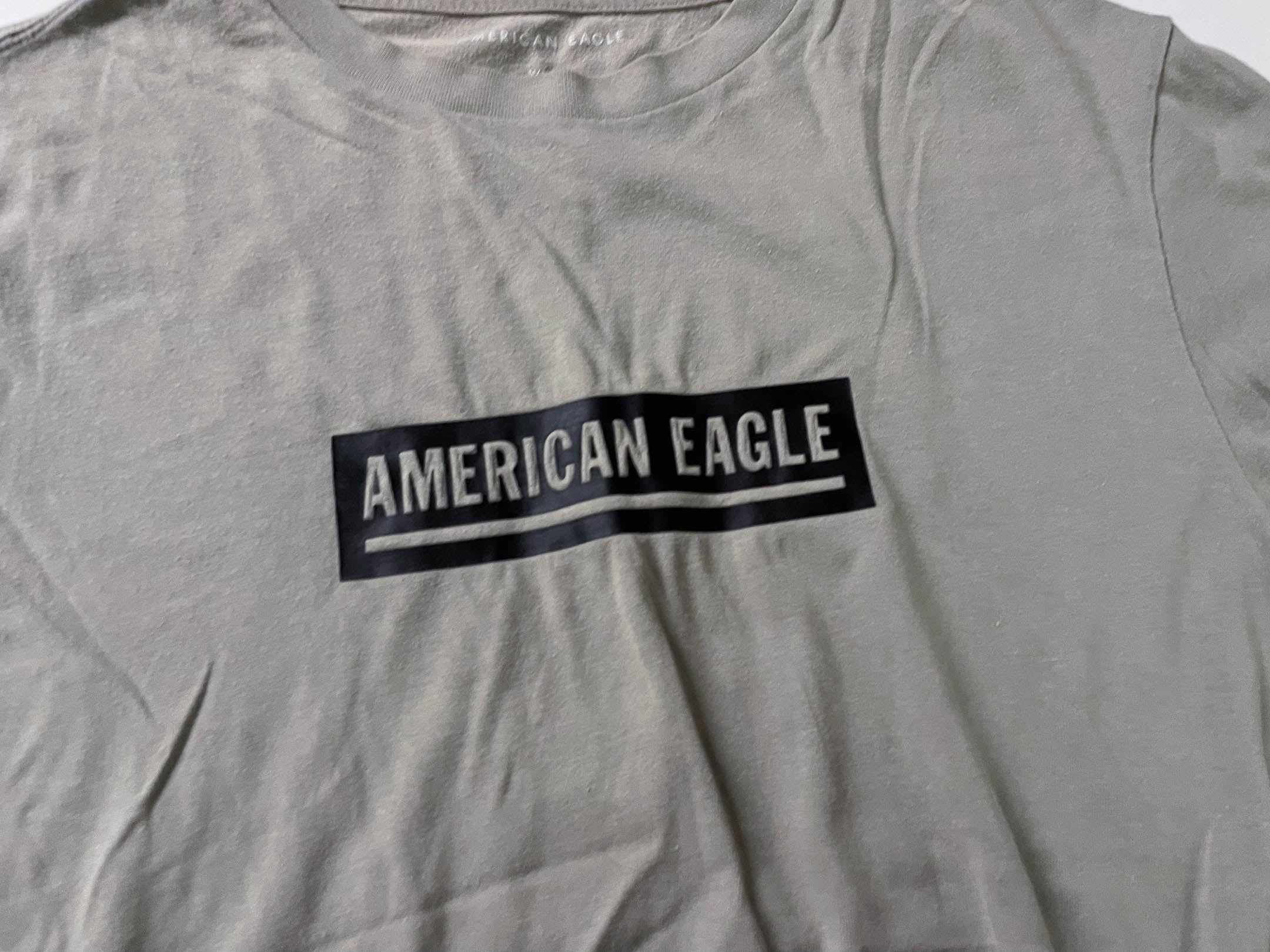 Vintage Men's American Eagle Cream standard fit tees in M|L27 W19|SKU 4132