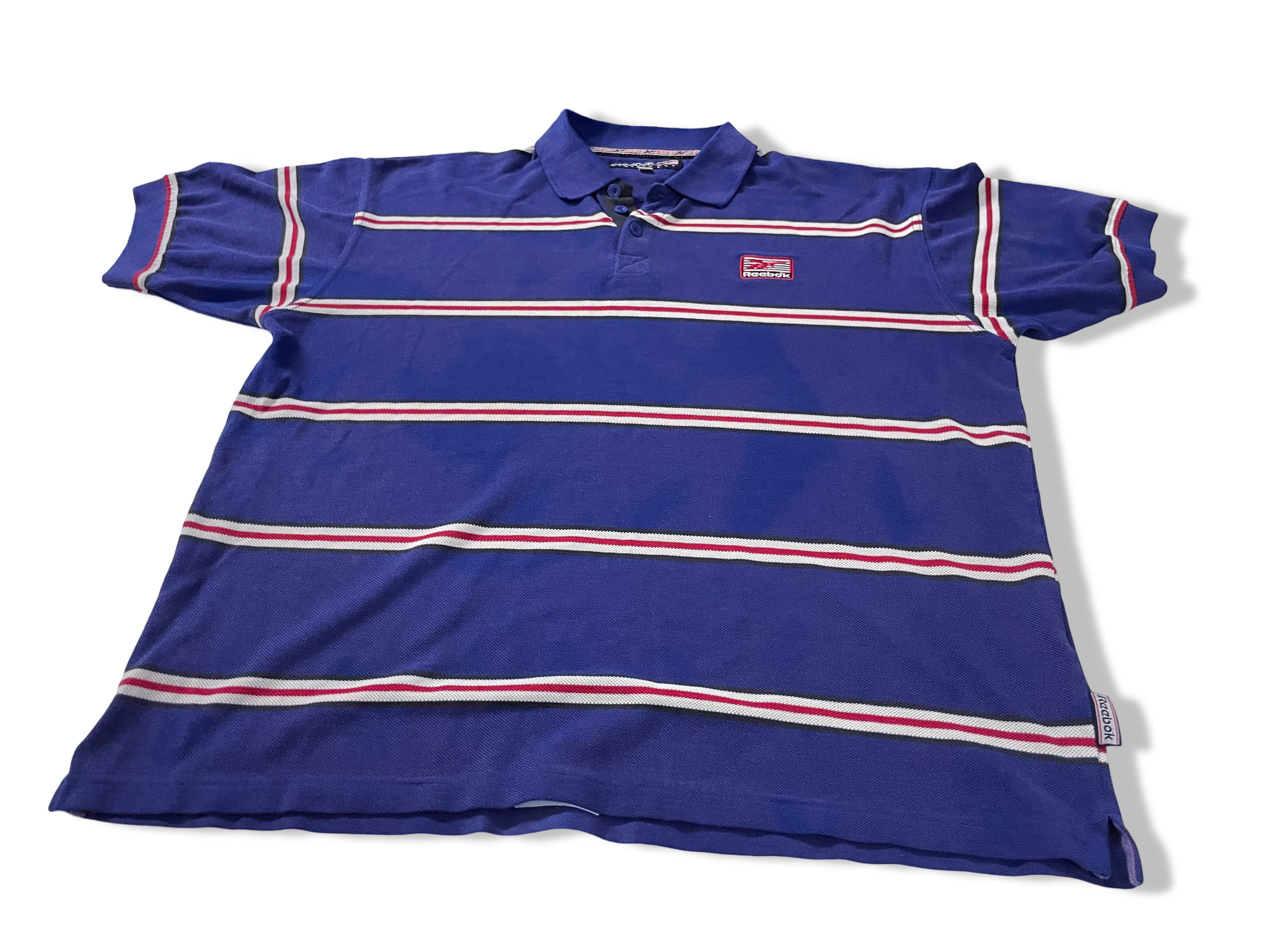 Vintage Men's Reebok Athletics Dept. Blue stripe polo shirt in M|L28 W20|SKU 4140