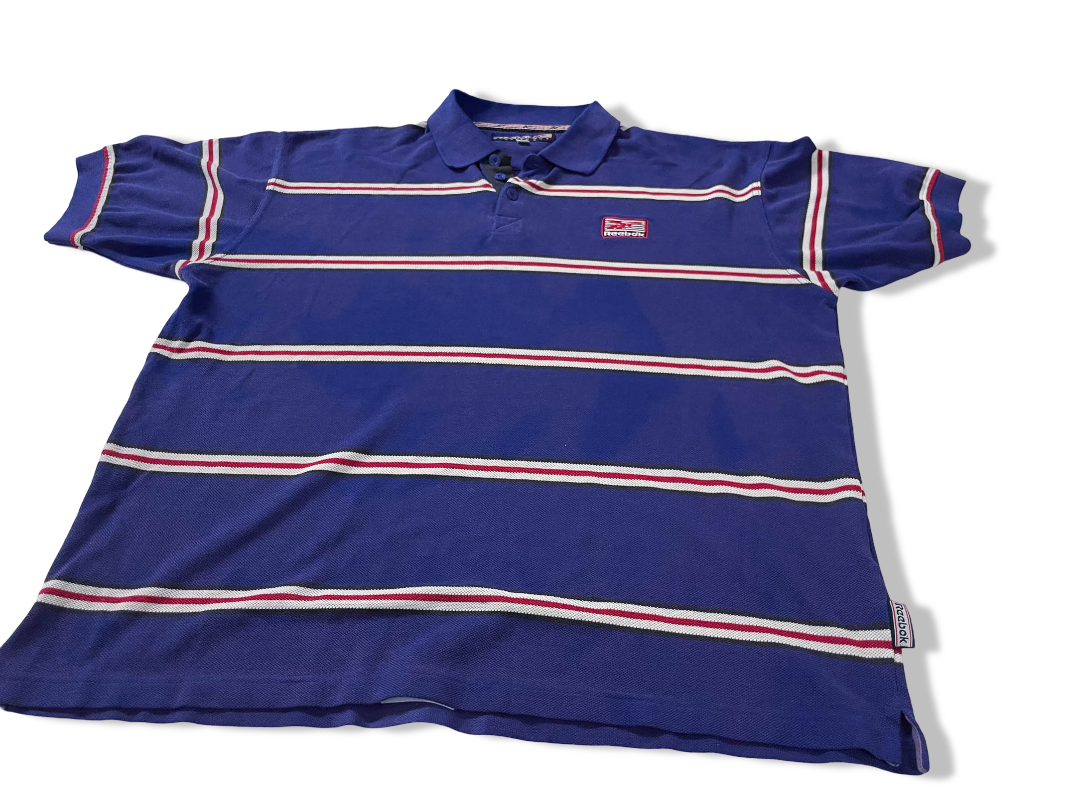 Vintage Men's Reebok Athletics Dept. Blue stripe polo shirt in M|L28 W20|SKU 4140
