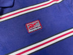 Vintage Men's Reebok Athletics Dept. Blue stripe polo shirt in M|L28 W20|SKU 4140