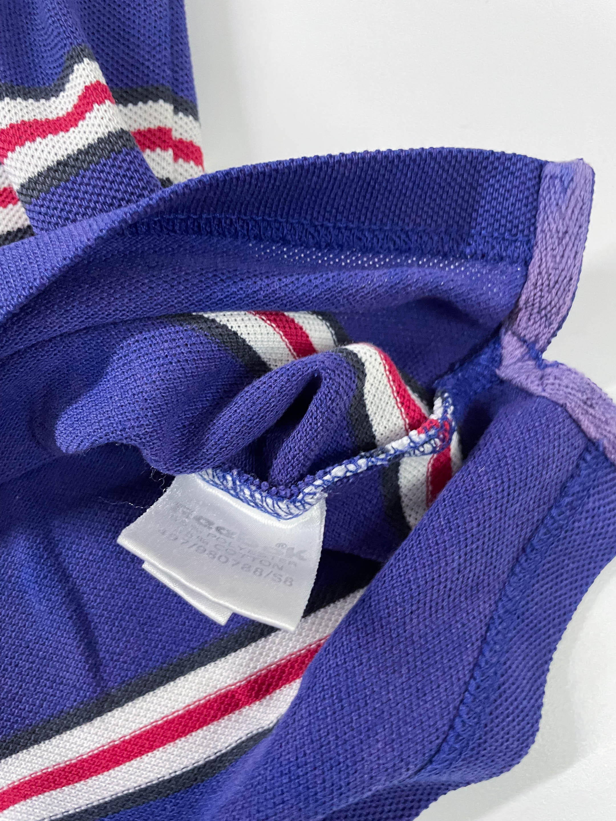 Vintage Men's Reebok Athletics Dept. Blue stripe polo shirt in M|L28 W20|SKU 4140