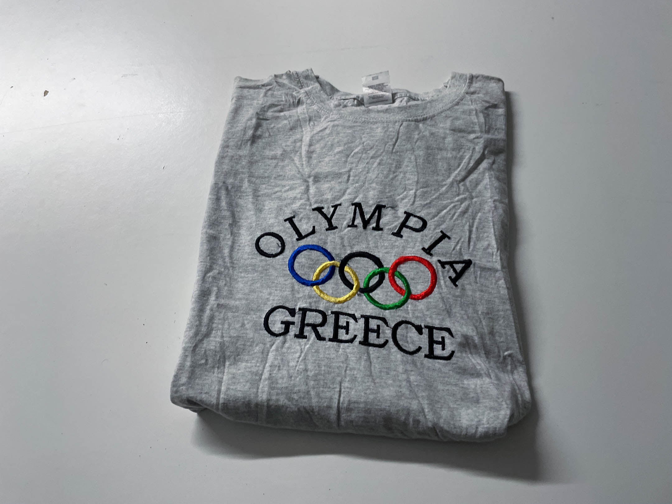 Vintage Men's Grey Fruit of the loom Olympia Greece logo Graphics tees in XL|L28W23|SKU 4054
