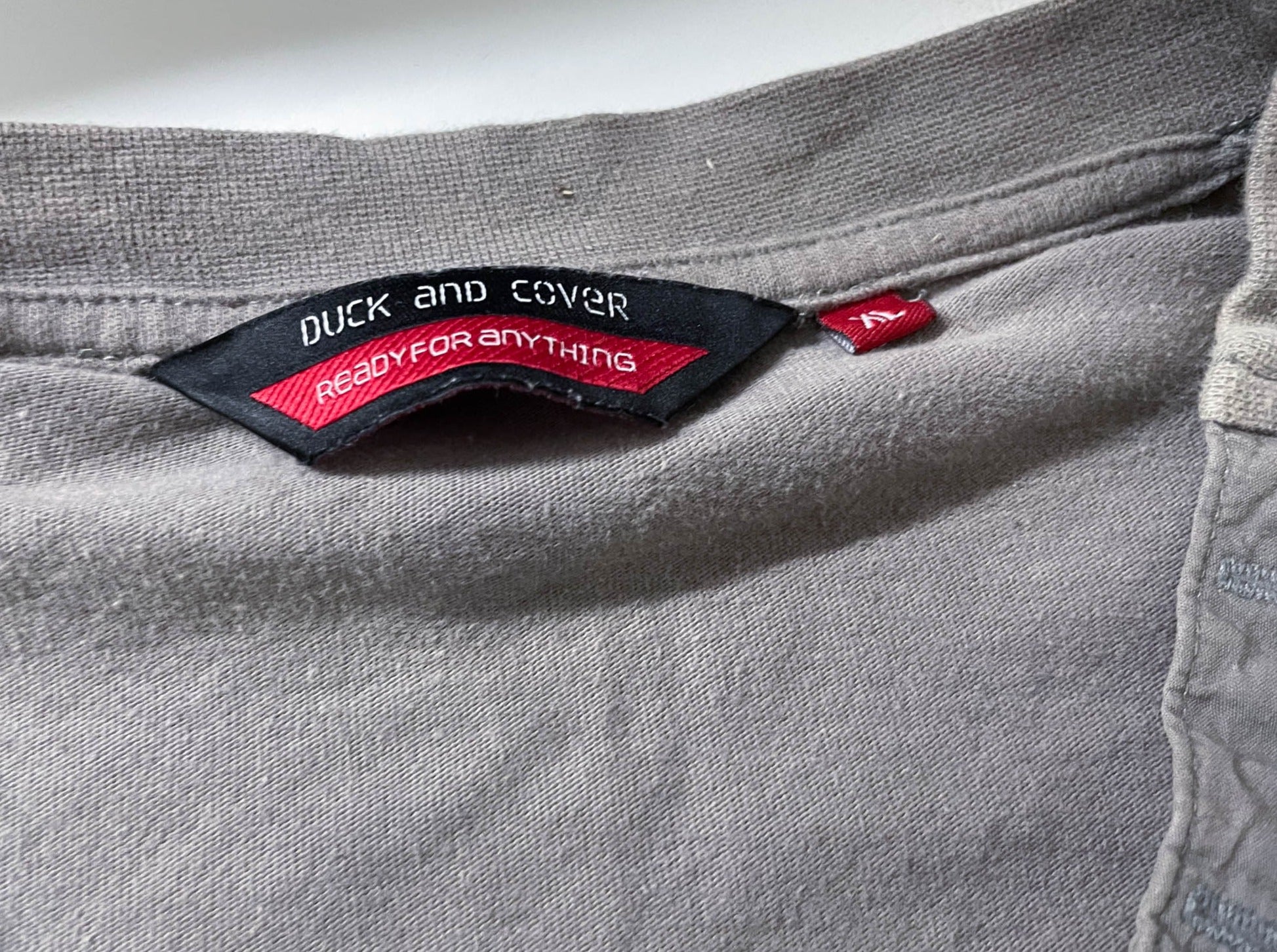 Vintage men's Duck & Cover 1/4 button v-neck grey short sleeve tees in M|L27 W21|SKU 4149