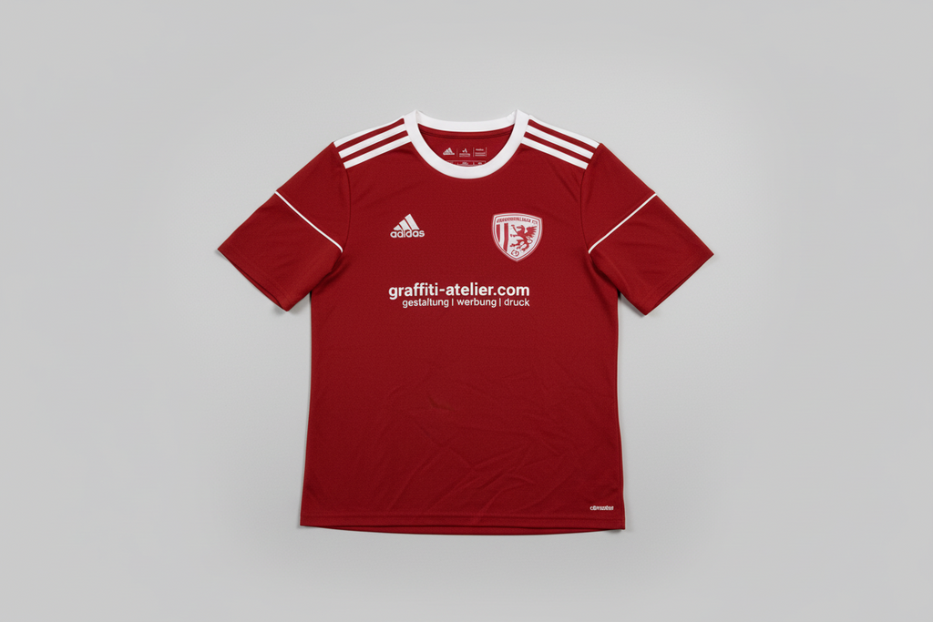 Red sports jersey with Adidas logo on a gray background