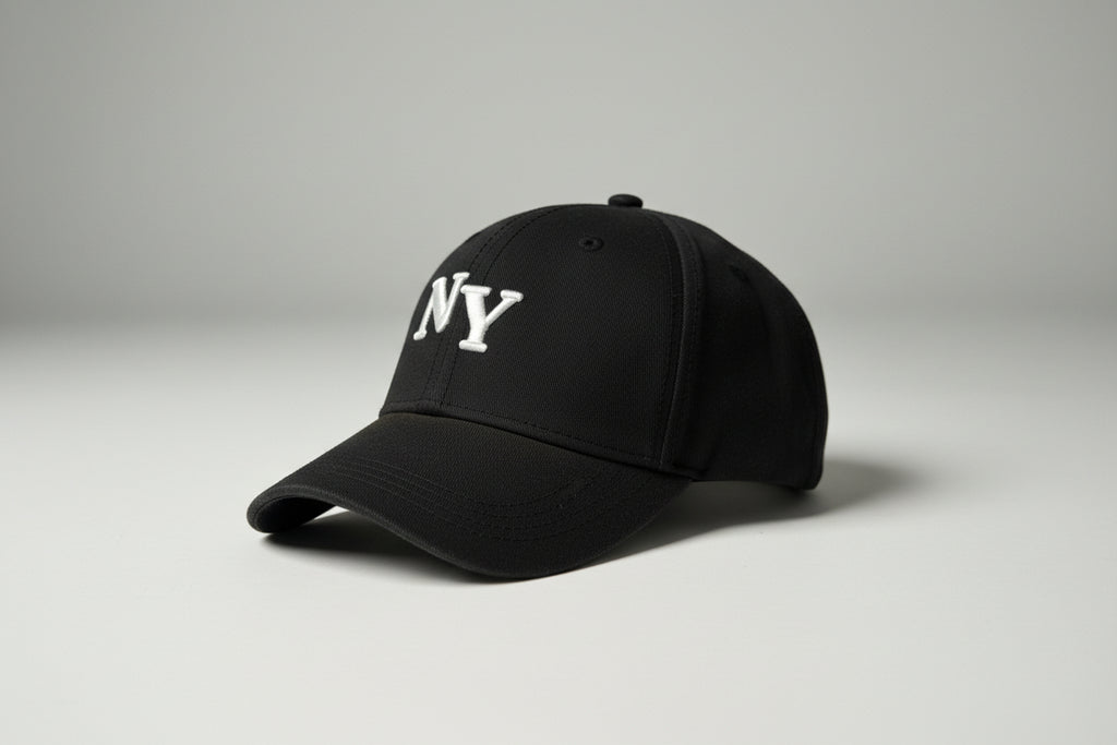 Black cap with 'NY' logo on a gray background