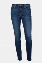 A pair of vintage blue American Eagle Outfitters skinny jeans laid out flat on a white background.
