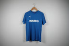 Blue sweatshirt with 'WABCO' branding on a hanger against a white wall.