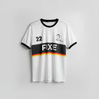 White sports jersey with black and red accents, featuring the number 22 and 'FXE' branding, hanging on a wooden hanger against a white wall.